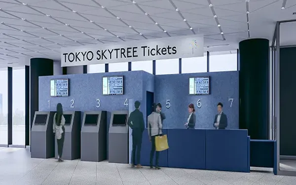 スタッフのいるカウンターと券売機が並んだチケットカウンター